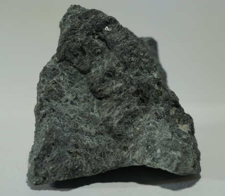 <a href="/photo-929628.html"><h1>Basalt, Augite, Fayalite-Forsterite Series</h1><h2>Guárico, Venezuela</h2><p>Porphyritic basalt, with phenocrysts of augite and olivine.  Specimen 3 of 30 from "The Rocks and the Minerals of Venezuela" collection.</p><p class="clickhere">Click here to view photo page on mindat.org</p></a>